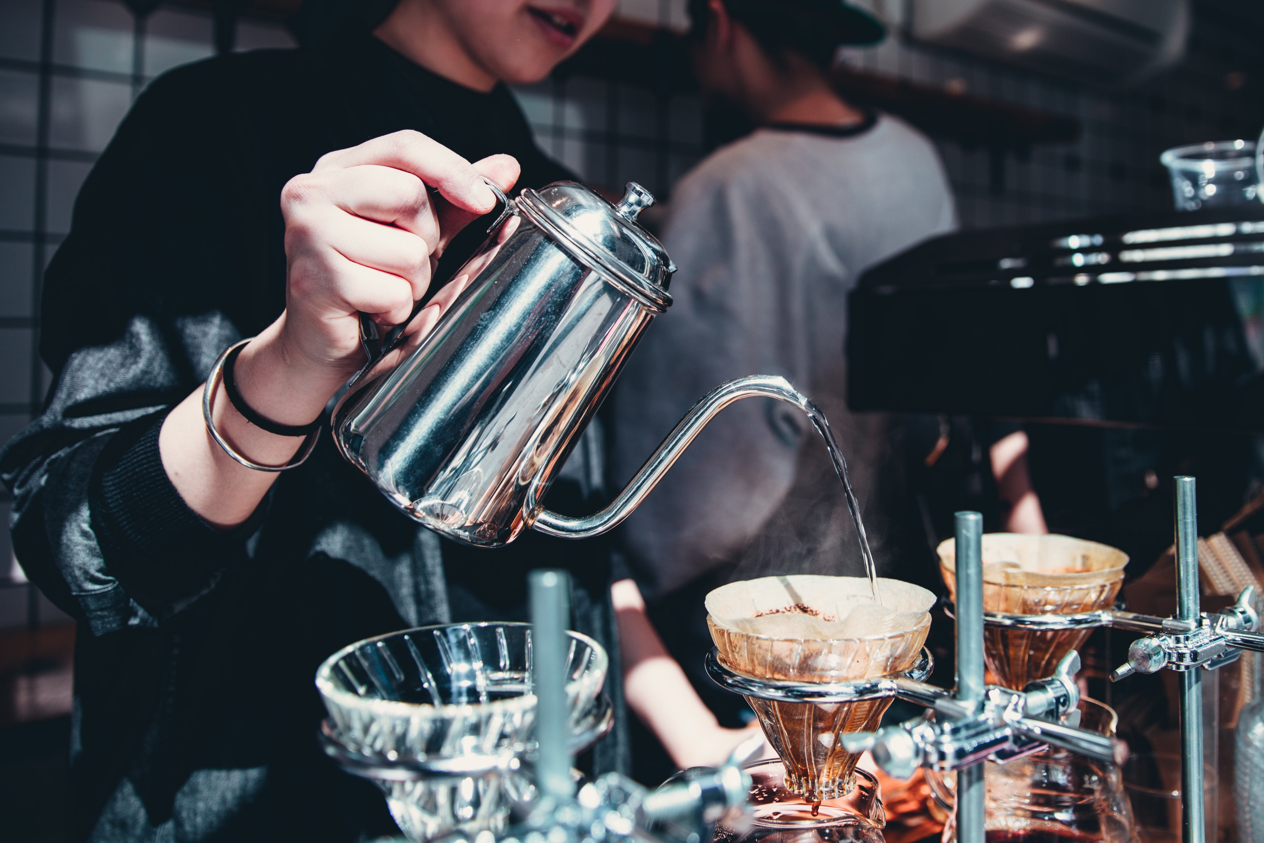 files/barista-pours-over-coffee-at-cafe.jpg